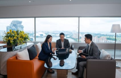 Bright coworking space with skyline views, modern seating, and collaborative atmosphere.