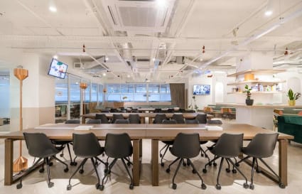 Modern coworking space with ample seating, natural light, and stylish decor in Jalan Kiara.