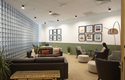 Modern coworking space with cozy seating, ambient lighting, and stylish decor in Selangor.