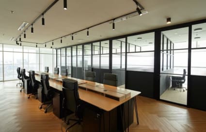 Modern coworking space with natural light and sleek furniture in Jalan Bukit Bintang.