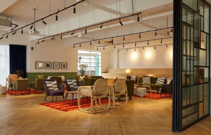 Spacious and stylish coworking area with modern seating and ample natural light.