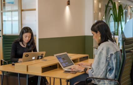 Modern coworking space with comfortable seating and ample natural light in Kuala Lumpur Sentral.