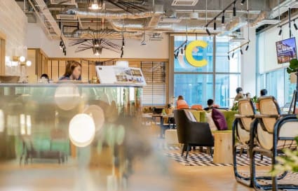 Vibrant coworking area with modern decor and ample natural light in Jalan Bangsar, Kuala Lumpur.