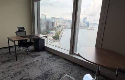 Bright coworking space with stunning harbor views in Tsim Sha Tsui.
