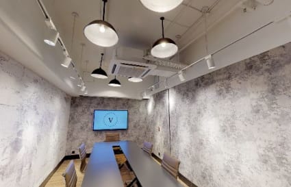 Elegant meeting room in Kwai Chung coworking space, featuring modern lighting and minimalist design.