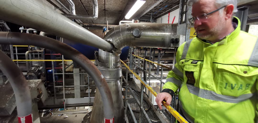 Fjell Technology Group CTO inspecting a plant.