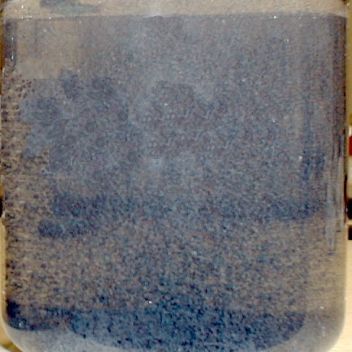 The untreated wastewater sample added 0.5 ppm of PAM. Stirred for approx. 30seconds. The flocculation establishes a phase separation.