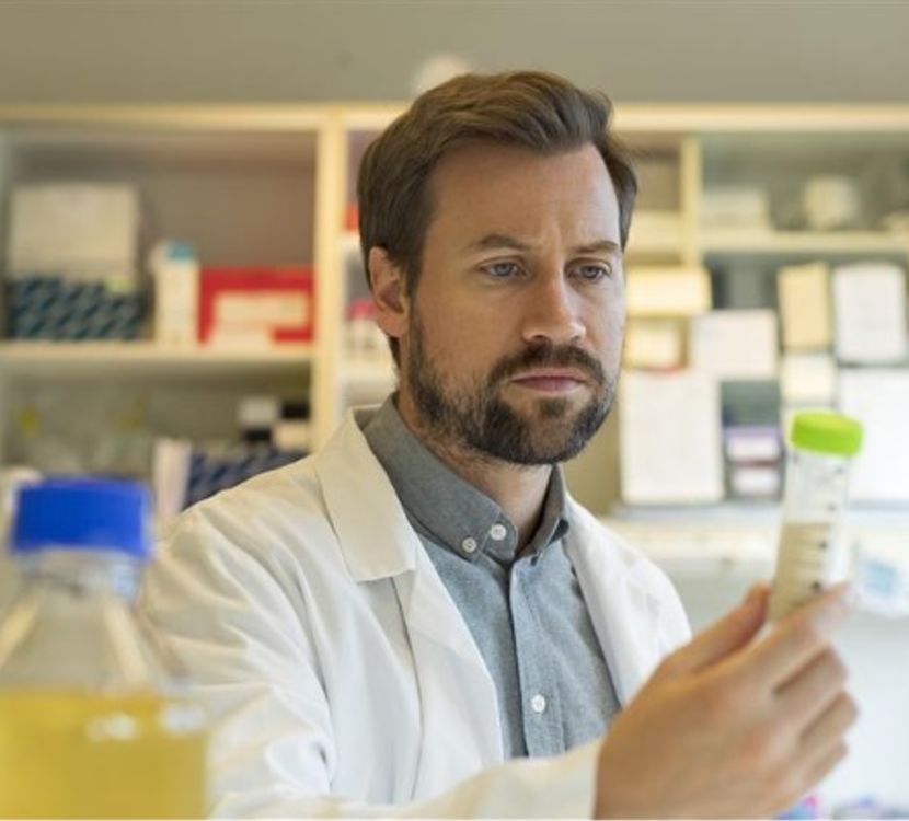 Researcher in lab examining enzymes