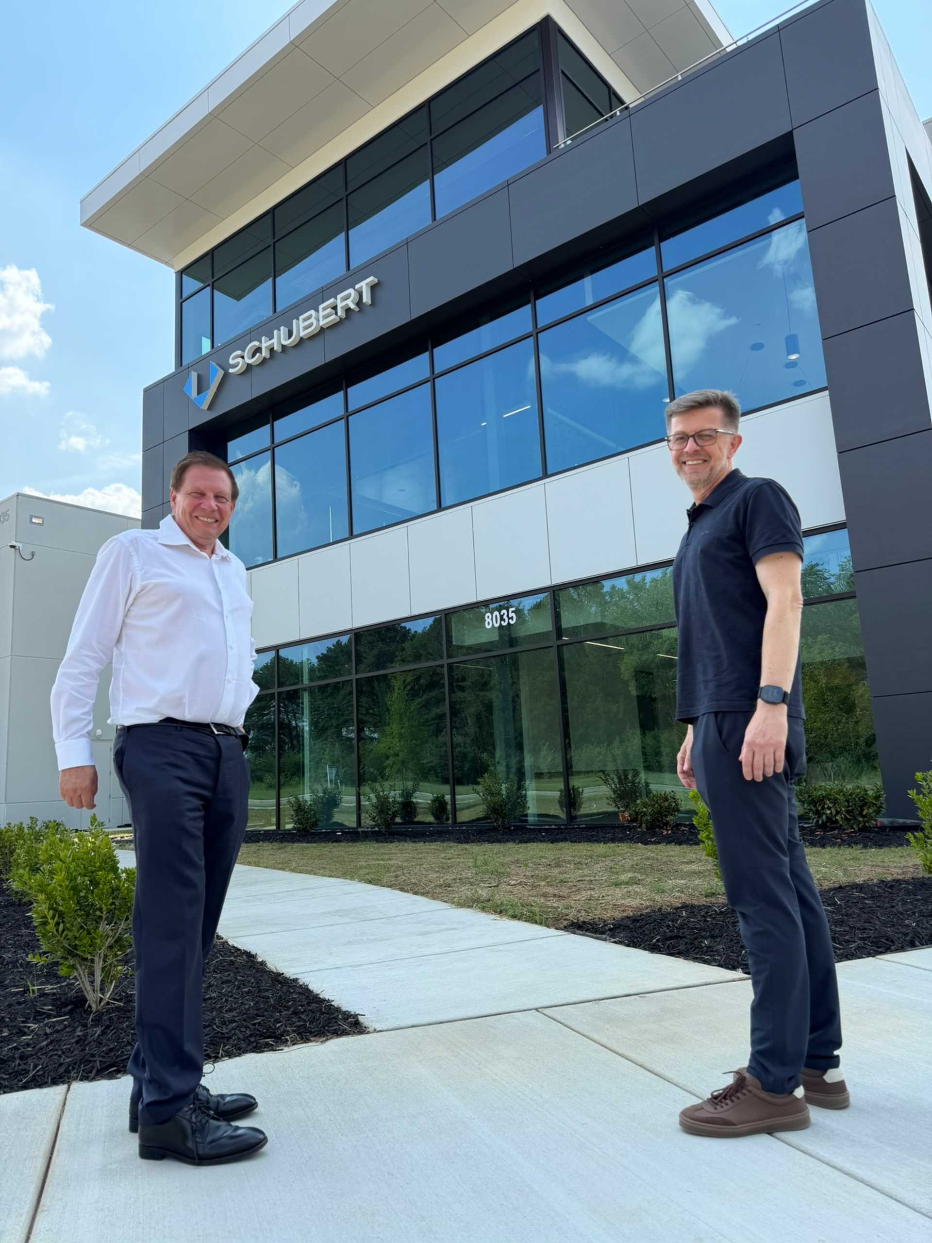Ralf Schubert, managing partner of Gerhard Schubert GmbH, and Hartmut Siegel, managing director of Schubert North America, in front of the new building in Charlotte