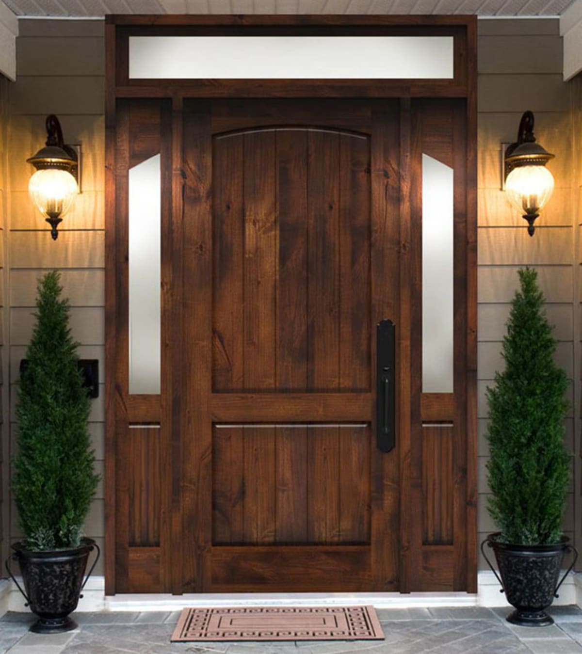 Wood front door with sidelights and a glazed transom