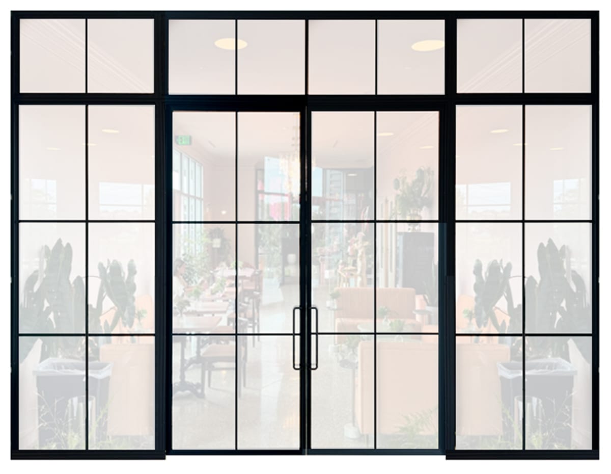 Black-framed Rustica interior window wall with a rectangular grid