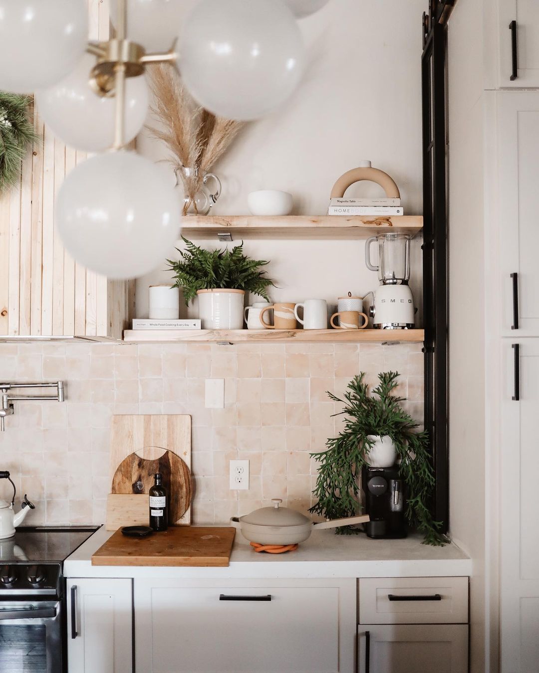 a contemporary kitchen with a sliding metal barn door