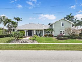 Coastal two-story home on water with pool/dock