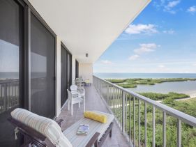 Beachfront condo with pool and ocean view from balcony