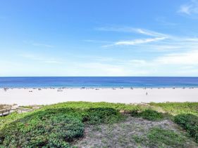 Ideally situated beachfront condo with pool and views