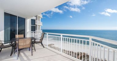 Paradise!!  Balcony seating for 4. Also includes reclining lounger (not shown). Access balcony from living area or master suite.
