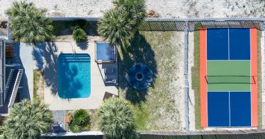 The only private pickleball court in Gulf Shores, private, heated pool, fire pit.