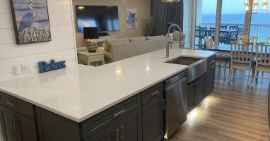 Quartz Countertops in kick-plate under counter kitchen - looking to living area