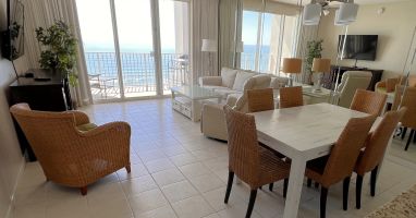 Endless water views from living, dining, kitchen. Slipcovered sofa. Roku 55 TV.