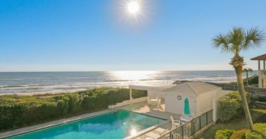 View from balcony looking West of pool, dunes, beach and gulf