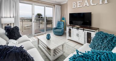 Our Gulf front living room has plenty of seating for family movie nights! 