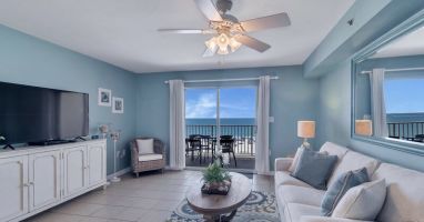 Spacious Living Room with views of the Beautiful Gulf of Mexico and access to Private Balcony and Full Size Sleeper Sofa