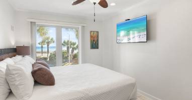 Wake up to stunning ocean views from your comfortable bed, with beach access just steps away through your private patio doors.