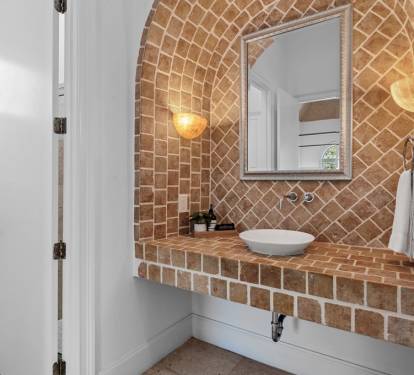 Architectural bath with custom tile and arched design