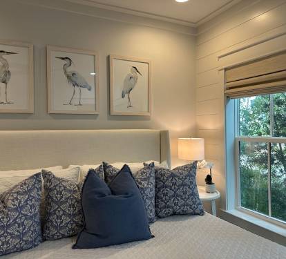 Spacious main level king bedroom suite with full ensuite bathroom, tiled shower and dual vanity sinks
