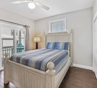 King bedroom on Main Level - access to the wrap around decks. This bedroom now has a king bed - stay tuned for updated photos!