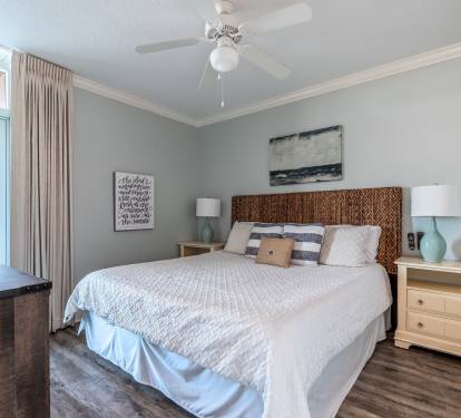 Second master bedroom with smart TV and private balcony entrance. 