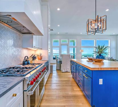 Cook on Wolf gas cooktop with double ovens.