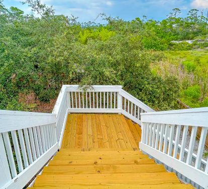 Back Deck Staircase leading to fenced area