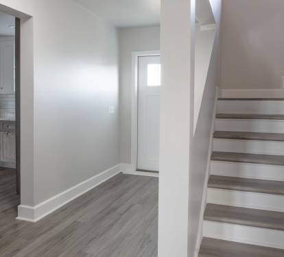 Entryway and staircase leading to 2nd Floor