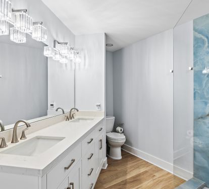 Master bathroom with double vanity and walk-in shower