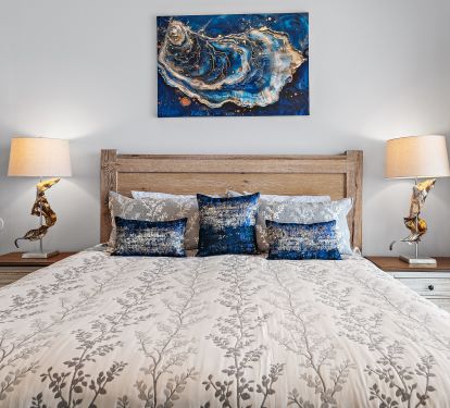 Master bedroom with king bed and balcony access