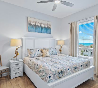 Guest king bedroom alternate view with nightstand and lamp