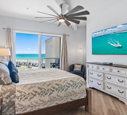 Master bedroom with king bed and balcony access