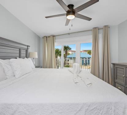 King sized bed and access to the balcony. 