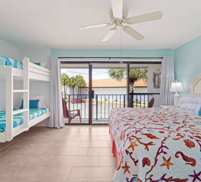 Bedroom 3, King with twin bunks, full bath & balcony access.