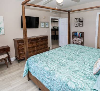 Master Bedroom, Dresser, TV, & Small Desk. 