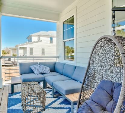 Multiple balconies outfitted with sleek, comfortable furniture