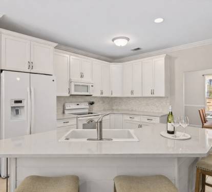 Bright, open kitchen—perfect for slow breakfasts, beach snacks, and wine nights. Guest Review, “Clean, comfortable, and felt like home the moment we arrived.”