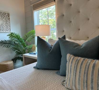 Spacious 2nd level king bedroom suite with full ensuite bathroom, tiled shower, dual vanity sinks, and newly remodeled outdoor shower.