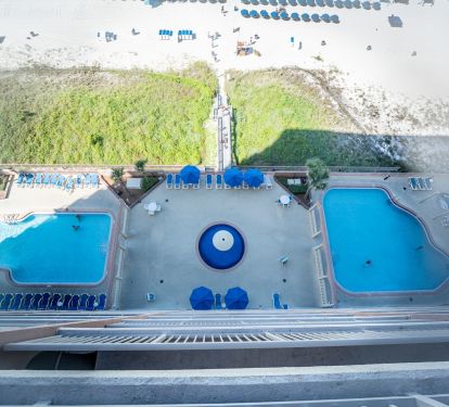 Patio view of the pool and hot tub areas