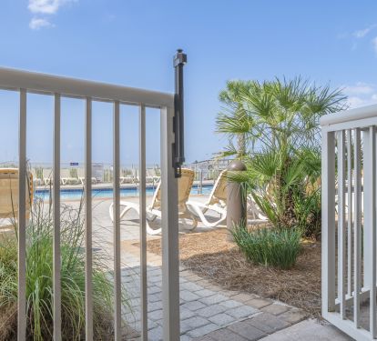 Patio w/ tall table &amp; chairs, walk out back gate to pool &amp; boardwalk to beach