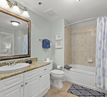Second king room en suite bathroom w/ tub and shower, also accessible from hall