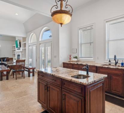 Kitchen island with prep sink and ample workspace