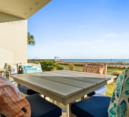 Outdoor dining patio with Gulf views- perfect for sunset meals 