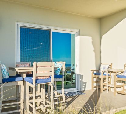 Outdoor dining and lounge area just 20 steps from the sugar sands of the Gulf